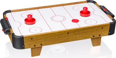 A miniature air hockey table with two red paddles and a white playing surface with red markings.