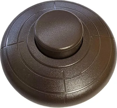 A close-up, isolated shot of a brown foot switch.