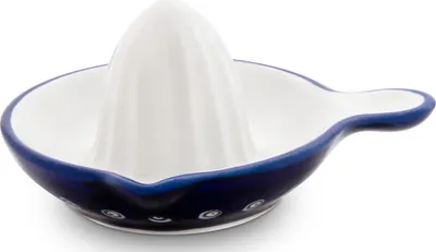 A white and blue ceramic citrus juicer with a handle.