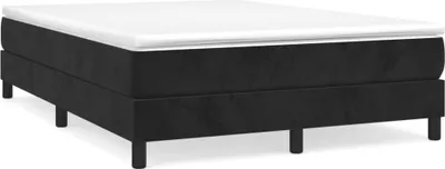A black boxspring bed frame with a white mattress topper, shown from a side angle on a white background.