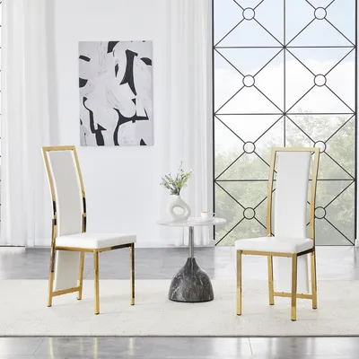 Produktbild von STILVORA Esszimmerstuhl mit ergonomischer Rückenlehne und 6 cm Polster, Metallrahmenstuhl mit galvanisch vergoldetem Rahmen und rutschfesten Gleitern, Kunstlederstuhl mit Goldkante, 2er-Set, Weiß