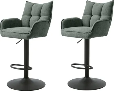 Two green bar stools with black bases are shown against a white background.