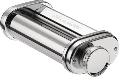 A shiny silver KitchenAid pasta roller attachment with a numbered dial.