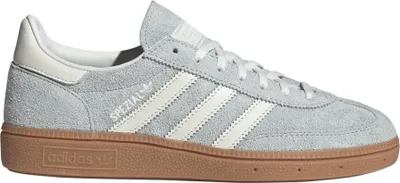 A side view of a grey Adidas Handball Spezial sneaker with white stripes and a gum sole.