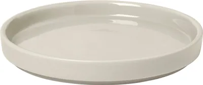 A single ceramic plate on a white background.