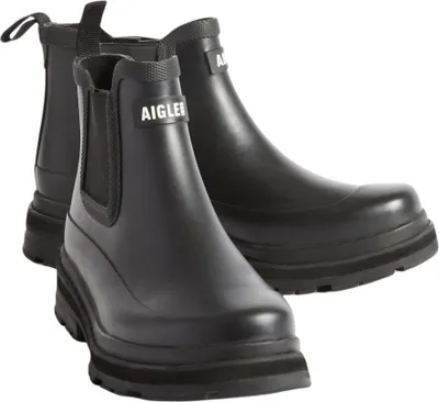 A pair of black Aigle rain boots on a white background.
