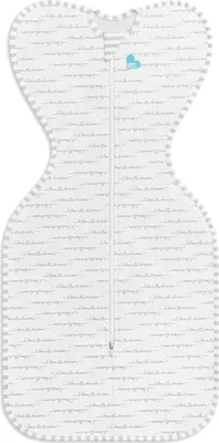 A white baby swaddle sack with a repeating pattern of the words "Love to Dream" in gray text.