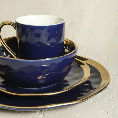 Produktbild von 16-teiliges Porzellan-Service-Set für 4 Personen mit blauer und goldener Rand