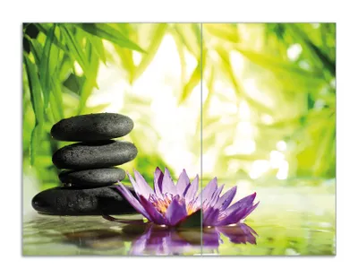 Produktbild von Wallario Herdabdeckplatte aus Glas, Größe 70 x 52 cm 2-teilig, Motiv Steinstapel in schwarz mit Blumenblüte in lila