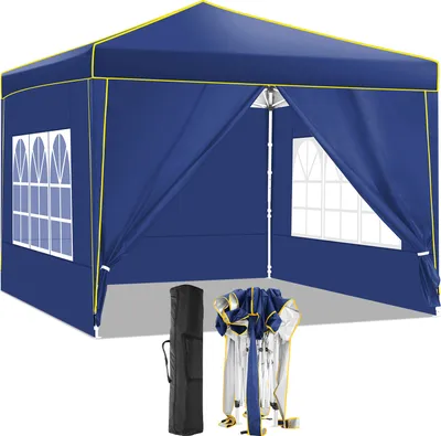 A blue pop-up gazebo with yellow trim, shown set up with windows. A folded gazebo and a carrying bag are on the ground in front of it.