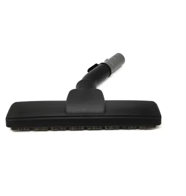 A vacuum cleaner floor head with a brush is shown against a white background.