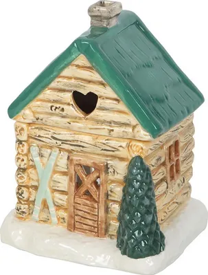 A ceramic oil burner shaped like a log cabin.