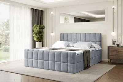 A bedroom scene with a bed as the main focus.