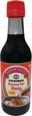 A bottle of Kikkoman soy sauce for rice, with a label showing the product name, brand logo, and an illustration of sauce being poured over rice.