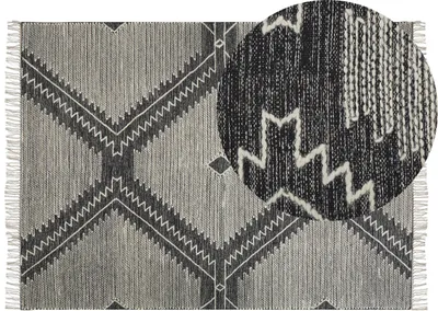 Produktbild von BELIANI Teppich Schwarz/Weiß aus Baumwolle 140 x 200 cm geometrisches Muster Rechteckig Kurzflor im Boho-Stil Wohn- und Schlafzimmer