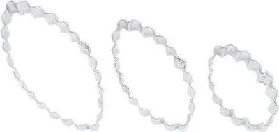 Three oval-shaped cookie cutters with scalloped edges are arranged diagonally on a white background.