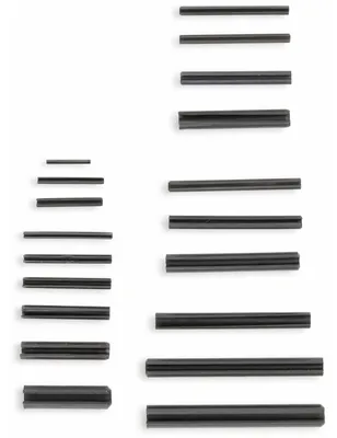 A collection of metal pins arranged in two columns against a white background.