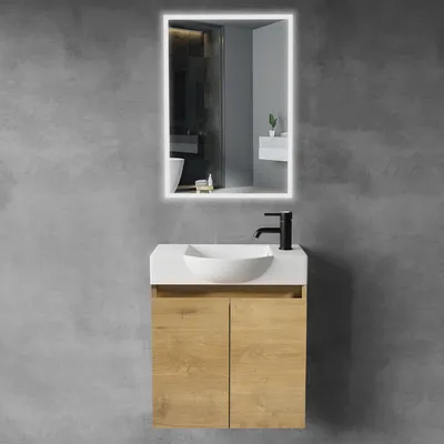 A modern bathroom vanity set with a ceramic sink and a backlit mirror against a textured gray wall.