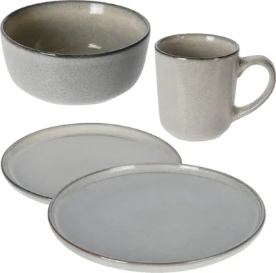 A set of ceramic tableware including a bowl, a mug, and two plates, arranged on a white background.