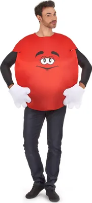A man wearing a red M&M costume with a face printed on it, black sleeves, and white gloves, standing against a white background.