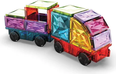 A toy truck and trailer made of colorful magnetic building blocks.