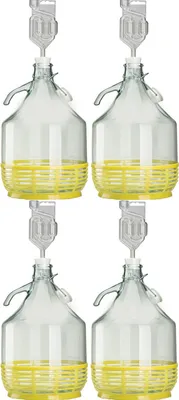 Four glass carboys with yellow protective baskets and airlocks.