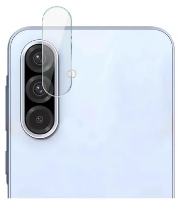 A close-up view of a smartphone camera lens protector being applied to a smartphone.