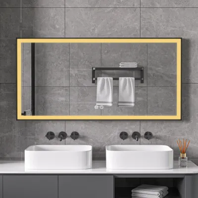 A modern bathroom vanity with two sinks, faucets, and a large illuminated mirror.