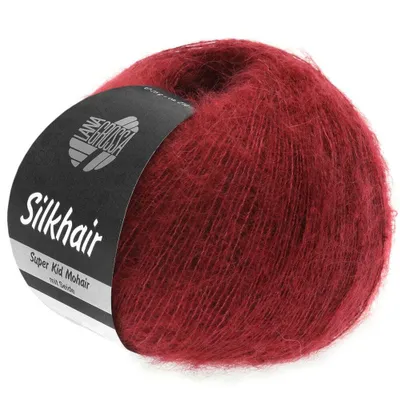 A ball of red yarn with a label.