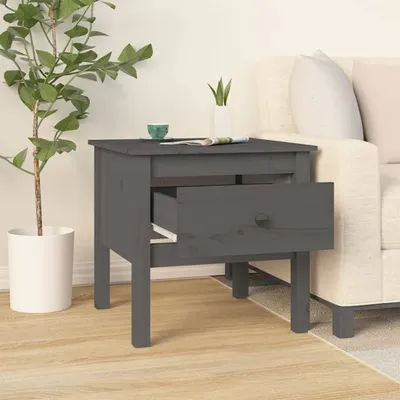 A bedside table is shown next to a sofa, with a plant and a cup on top.