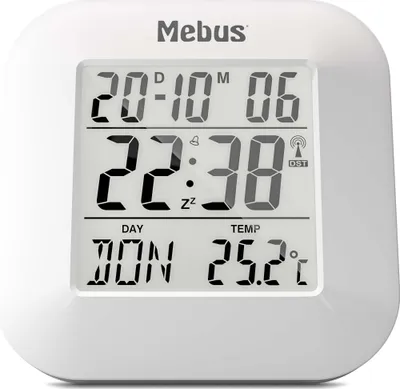 A white Mebus digital clock with a black LCD screen displaying the time, date, and temperature.