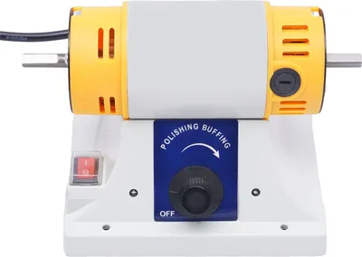 A close-up studio shot of a mini bench grinder/polisher.