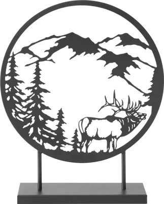 A black metal silhouette of a deer and mountain landscape, mounted on a black stand.