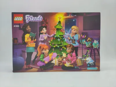 A LEGO Friends advent calendar box showing a group of girls decorating a Christmas tree and opening presents.
