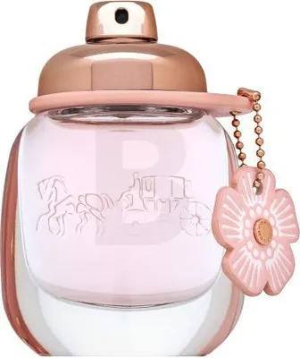 A close-up studio shot of a Coach Floral Eau de Parfum bottle.
