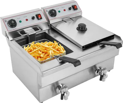 A commercial deep fryer filled with french fries.