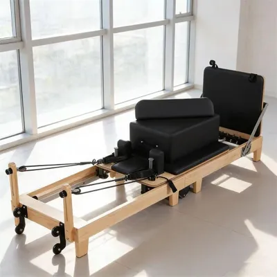 Produktbild von Pilates Reformerbett - Klappbares Gerät - Verstellbarer Widerstand - Tragkraft 250 kg - Kunstleder & Holzrahmen - Ganzkörpertraining - Schwarz