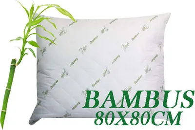 A white pillow with green bamboo leaf patterns and text overlay.