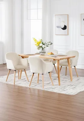 A dining room setting with a wooden table and chairs.