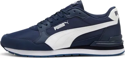 A side view of a blue Puma sneaker with a white stripe.