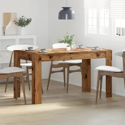 A dining table with chairs in a room.