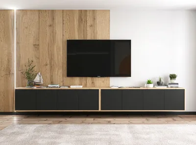 A modern living room setup featuring a wall-mounted TV and a long, low media console.
