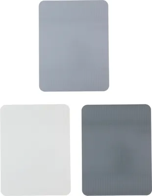 Three cutting boards of different colors are arranged in a top-center and bottom-left/right configuration against a white background.