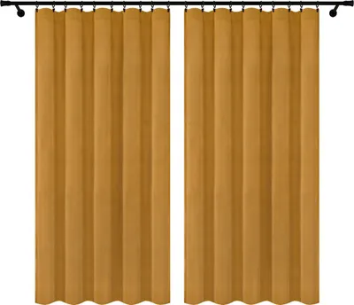 Two yellow velvet curtains hanging on a curtain rod against a white background.