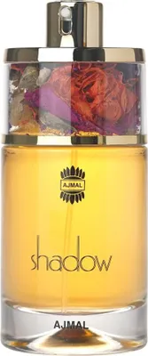 A perfume bottle with dried flowers inside the cap.