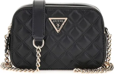 A black quilted crossbody bag with a silver chain strap and a Guess logo.