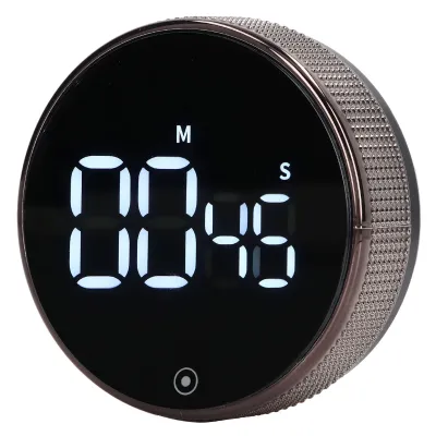 A digital kitchen timer with a black face and a textured gray bezel.