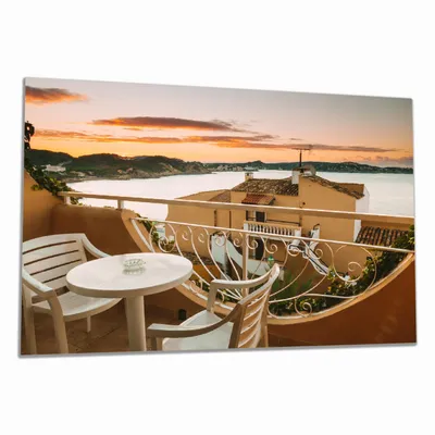 Produktbild von Wallario Herdabdeckplatte aus Glas, Größe 80 x 52 cm 1-teilig, Motiv Sommer in Spanien - Ausblick von einer schönen Terrasse auf das Meer