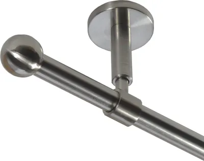 A close-up view of a metal curtain rod with a spherical finial, mounted to a ceiling.
