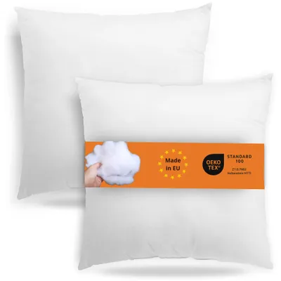 Two white pillows are shown, one slightly behind the other. An orange band wraps around the front pillow, displaying product information and certifications.